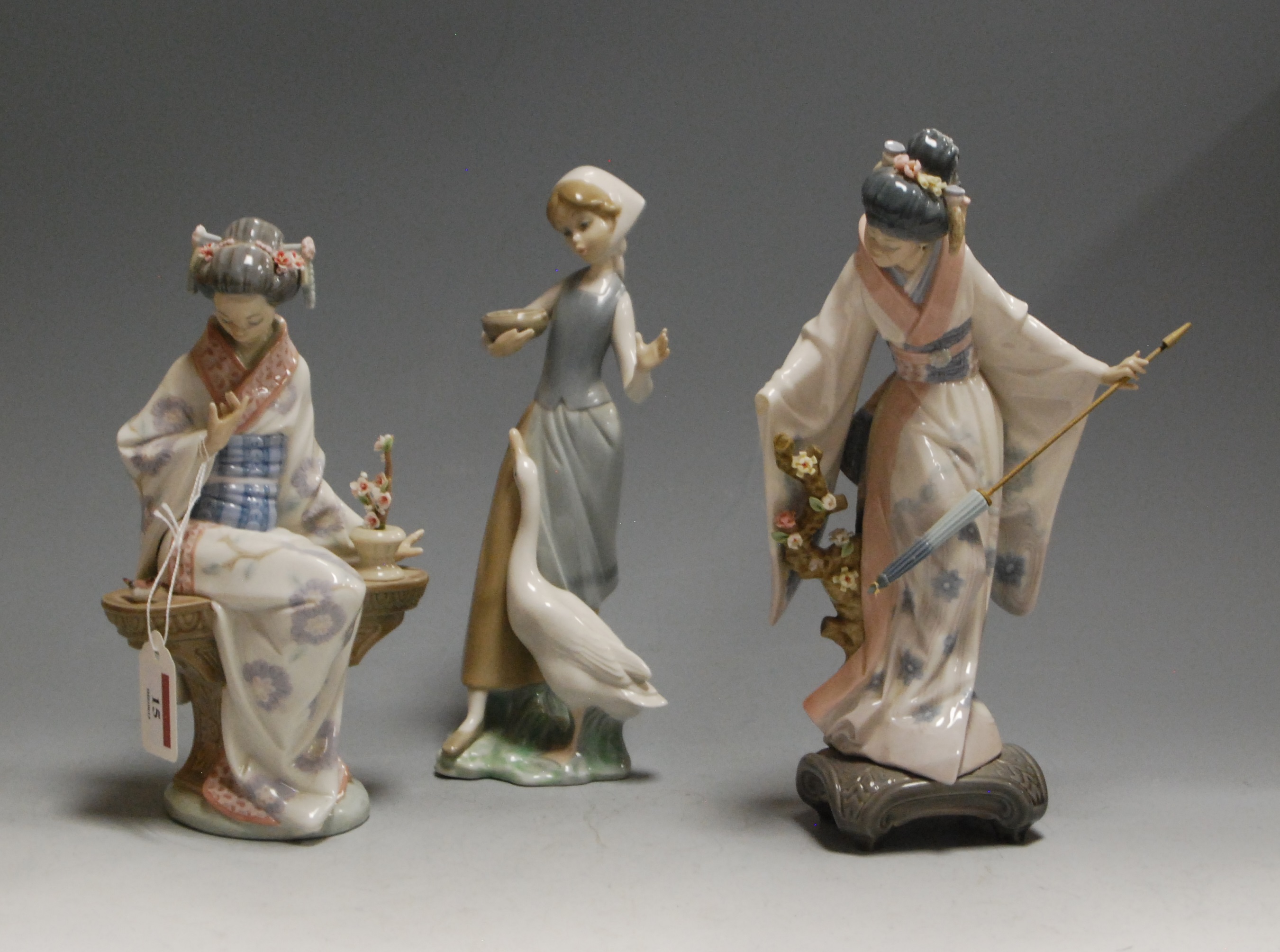 A Lladro figurine of Japonesa Serenidad, boxed; together with one other Lladro figure of a Geisha