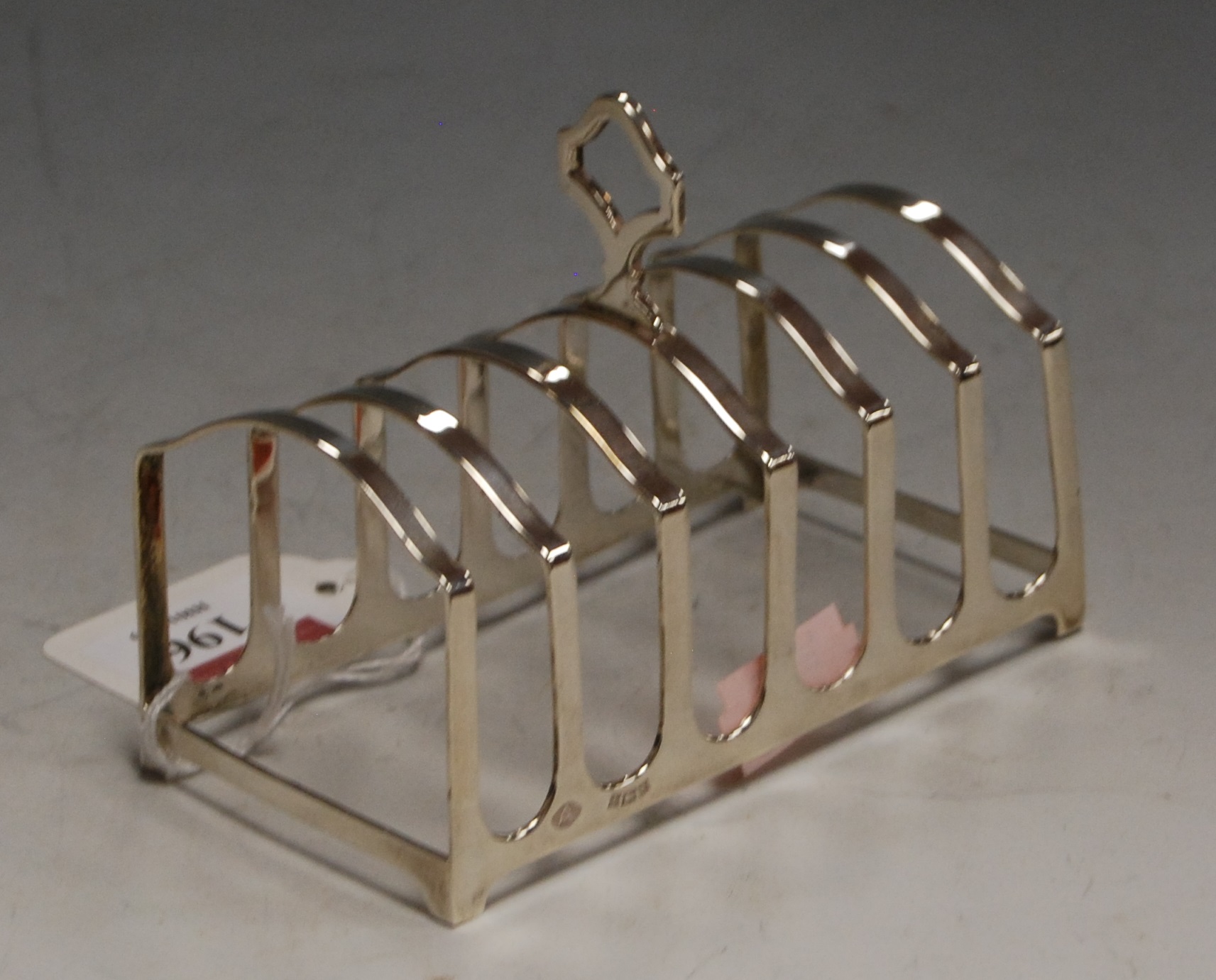 A modern silver six division toast rack by Adie Brothers, Birmingham