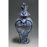 A 19th century Dutch Delft blue and white vase and cover, of baluster form, decorated in the Chinese