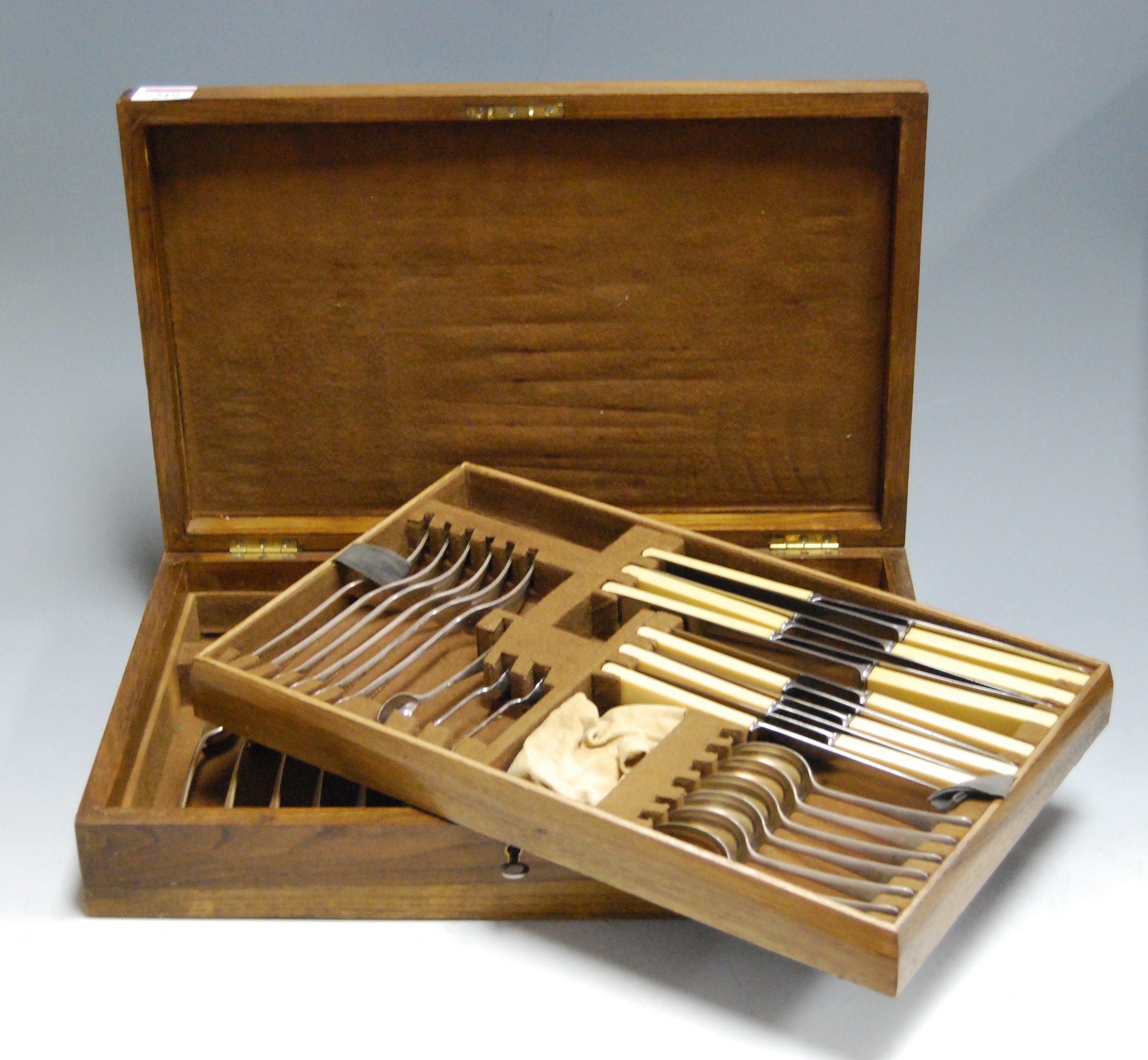 A mid-20th century oak cased canteen of silver plated cutlery (incomplete six place setting)