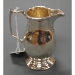 A George VI silver helmet shaped cream jug by Mappin & Webb, Sheffield 1940, 5.2oz