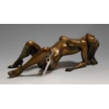 A modern bronzed resin figure of a female nude in erotic pose, w.32cm