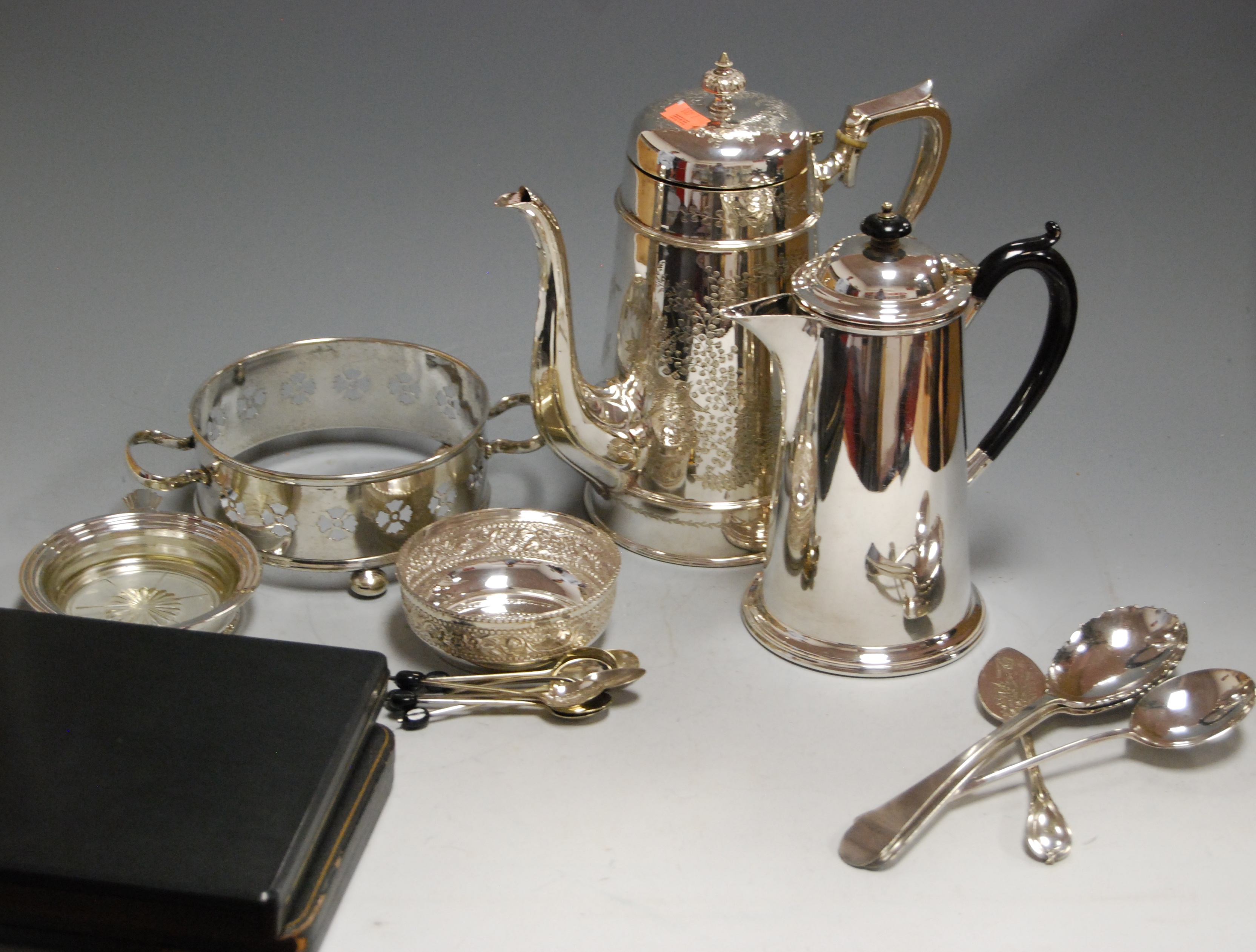 A box of miscellaneous silver plated wares, to include coffee pot, coffee spoons, dish ring etc