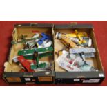 Two boxes containing eight various modern tinplate hand built model aircraft, mixed examples to