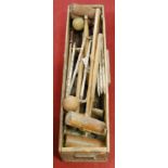 A mid 20th century lawn croquet set in pine case