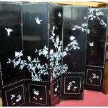 A contemporary Japanese black lacquered and mother of pearl inlaid six fold dressing screen,