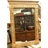 A reproduction gilt composition wall mirror, h.91cm