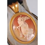 An Etruscan revival carved cameo pendant/brooch in fitted case, the oval shell cameo of Astraea, the