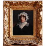 19th century English school - Bust portrait of a middle-aged woman wearing a lace bonnet, oil on