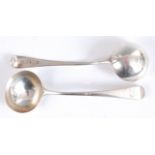 A pair of George III silver sauce ladles, in the Old English pattern, having armorial engraved