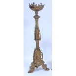 A large cast brass alter stick, in the 17th century Baroque style, the triform column set with