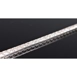 A diamond line bracelet, the round brilliant cut diamonds, total estimated approx. 3.64cts, all claw
