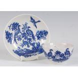 A Worcester porcelain blue and white tea bowl and saucer, printed in the Birds in Branches