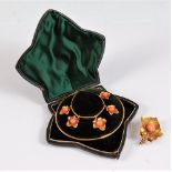 A 19th century coral set ivy leaf necklace and matching brooch, the five graduated