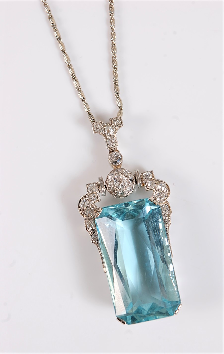An Art Deco aquamarine and diamond pendant, the emerald cut aquamarine measuring, approx. 27 x 15. - Image 7 of 10
