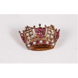 A 9ct ruby and seed pearl naval crown brooch, set with alternating panels of small round rubies