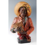 A large early 20th century Goldscheider style Austrian painted terracotta pedestal bust of a black