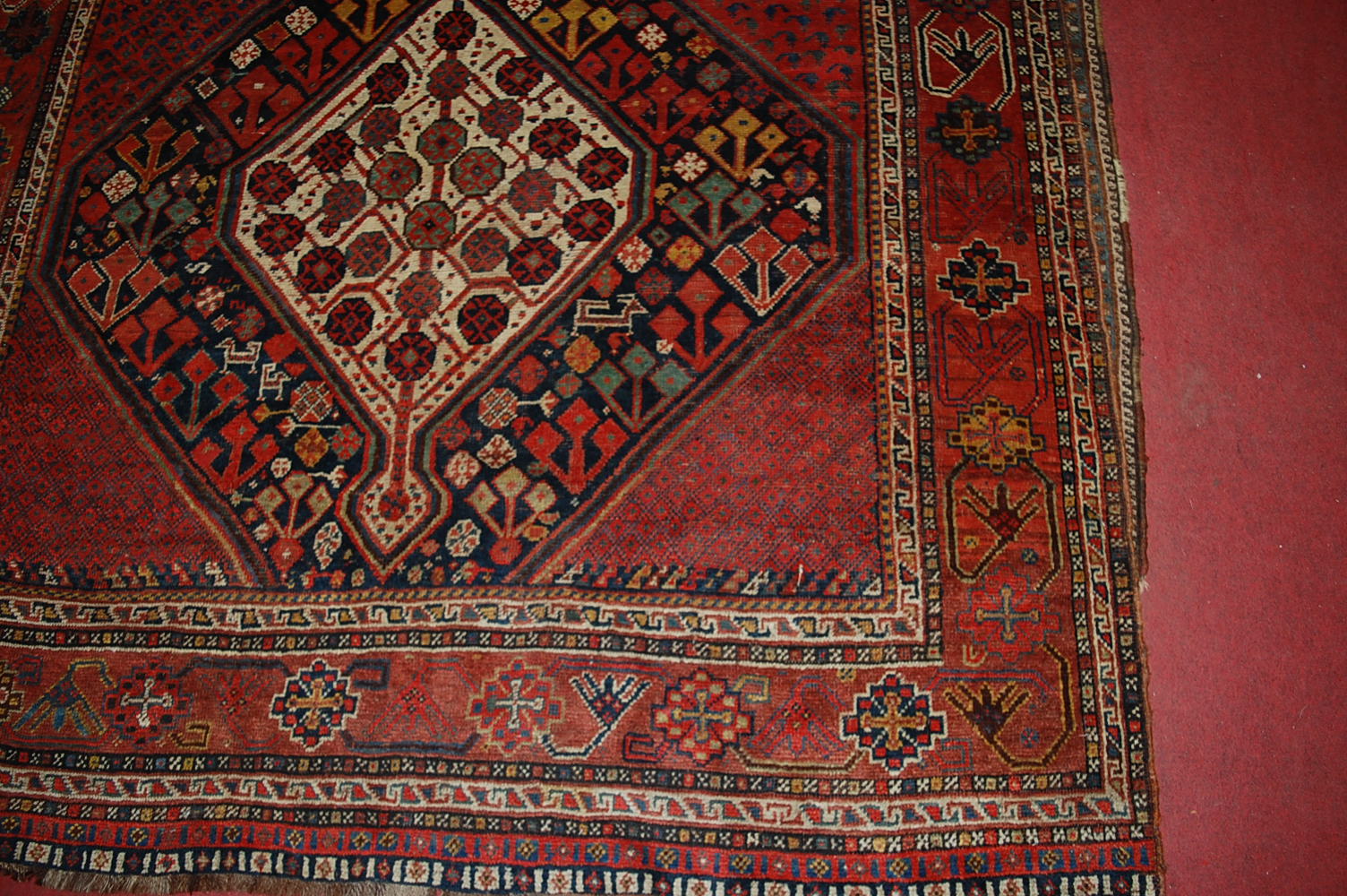 A late 19th century Persian woollen Luri rug, the rust coloured field decorated with three linked - Image 3 of 7