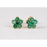 A pair of emerald flowerhead cluster earstuds, the round emerald clusters, each approx. 10mm
