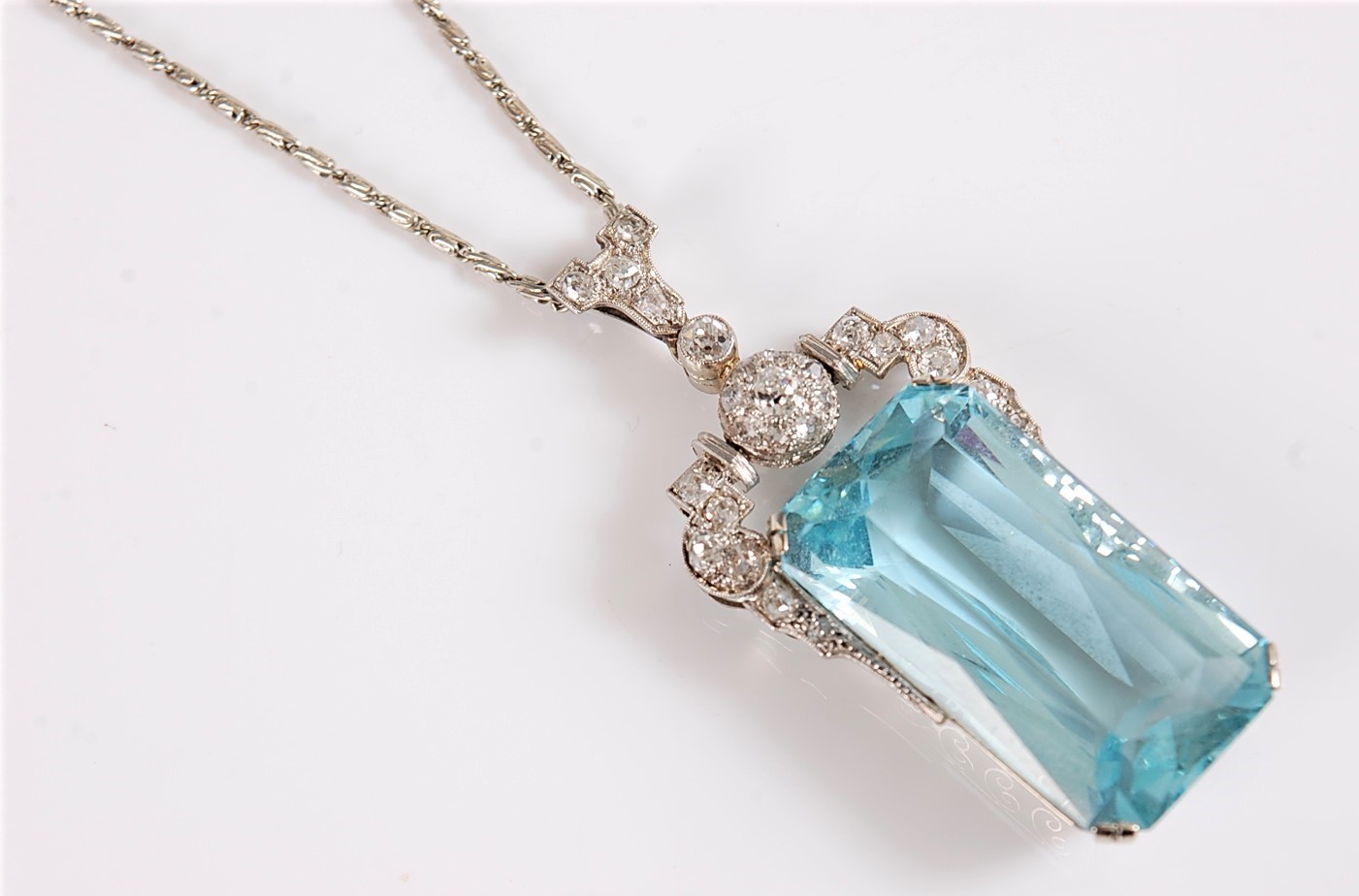 An Art Deco aquamarine and diamond pendant, the emerald cut aquamarine measuring, approx. 27 x 15. - Image 8 of 10