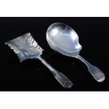 A William IV silver caddy spoon in the kings pattern, having a fluted waisted rectangular bowl,