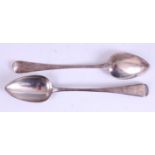 A pair of George III silver stuffing spoons, in the Old English pattern, each having monogrammed