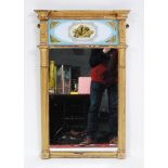 A late 19th century giltwood and gesso pier glass, having a reverse painted glass frieze over a