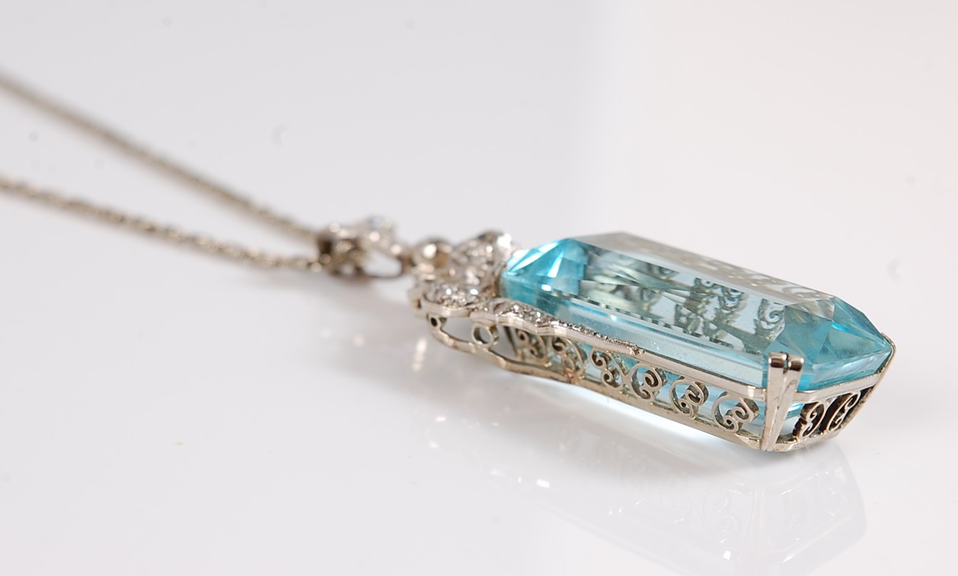 An Art Deco aquamarine and diamond pendant, the emerald cut aquamarine measuring, approx. 27 x 15. - Image 9 of 10