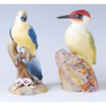 A Royal Worcester porcelain woodpecker, No.3249, black mark, h.18cm; together with a Royal Crown