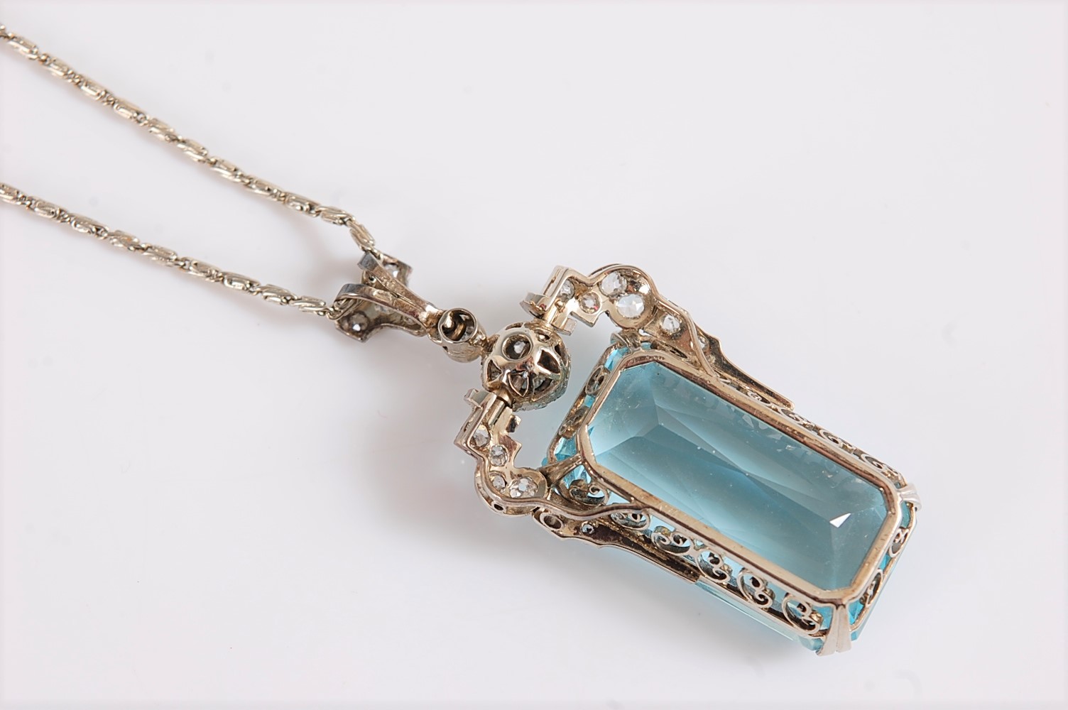 An Art Deco aquamarine and diamond pendant, the emerald cut aquamarine measuring, approx. 27 x 15. - Image 4 of 10