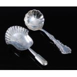 A late Victorian silver caddy spoon, having a fluted bowl and scroll decorated stem, maker George