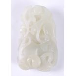 A Chinese celadon jade carving of a boy with elephant amidst scrollwork, 9cm