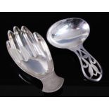 A George VI silver caddy spoon in the form of a right hand, maker Francis Howard Ltd, Sheffield,