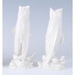 A pair of first period Belleek porcelain fish spill vases, each modelled as vertically posed
