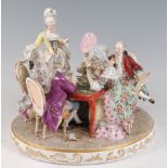 A late 19th century continental porcelain table centrepiece of card-players , the six high society