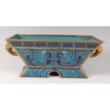 A Chinese cloisonné enamel and gilt bronze censor, of tapering rectangular form, decorated with red,