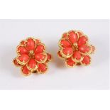 A pair of Boucheron 18ct coral flowerhead cluster earrings, comprised of two tiers of pear shaped