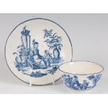 A Worcester porcelain tea bowl and saucer, blue and white printed in the Mother & Child pattern,