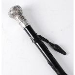 A George V swagger/walking stick, the leather wrapped ebony shaft with a silver terminal embossed