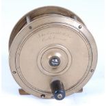 A John Enright & Son 4" brass centre pin reel, having a four spoke frame and ebony handle, signed