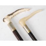 Two early 20th century plaited leather clad riding crops, each having a stag antler handle and