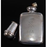 An Edwardian silver pocket hip flask engraved with crossed spears initialed ECT and further