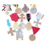 A collection of 12 Continental medals to include German Cross of Honour with swords, Belgian Leopold