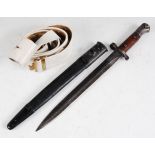 A British 1903 pattern bayonet, the 30.5cm double edged blade stamped to the ricasso with a