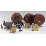 A circa 1900 mahogany 6" centre pin sea reel, having a brass star back and brass foot, stamped