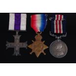 A George V Military Cross group of three to include M.C., unnamed and in original leather case,