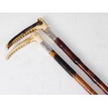 An Edwardian riding crop, having a bamboo shaft with stag antler handle and silver collar engraved