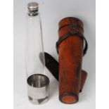 An early 20th century hunting flask, having a conical glass body with silver plated bayonet cap