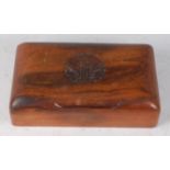 An early 20th century Indian hardwood table cigarette box, the hinged lid carved with the crest of