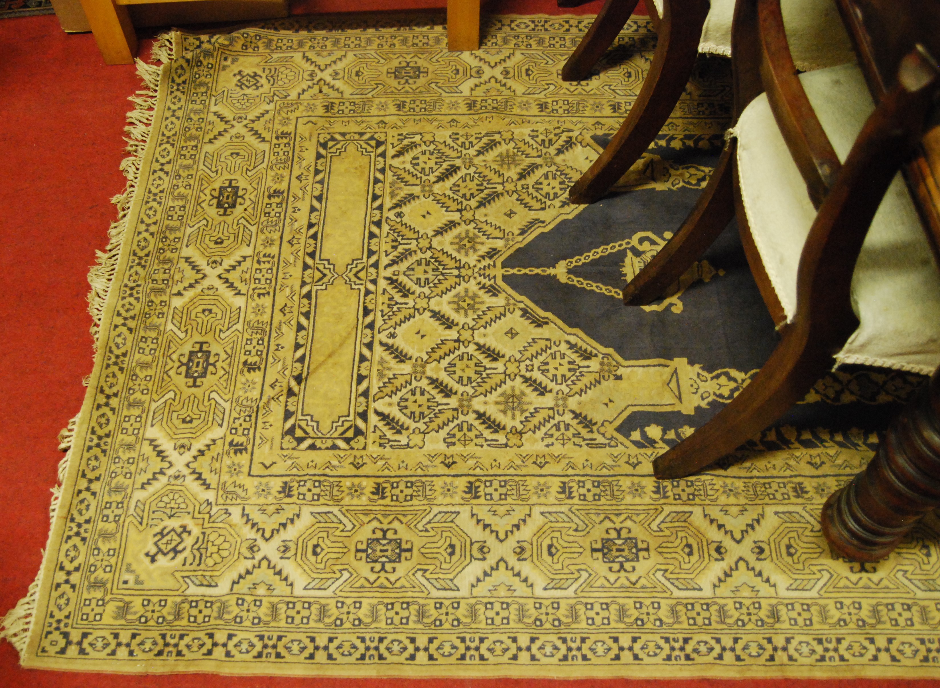 A Persian woollen buff ground prayer rug, having all over geometric floral stylised decoration